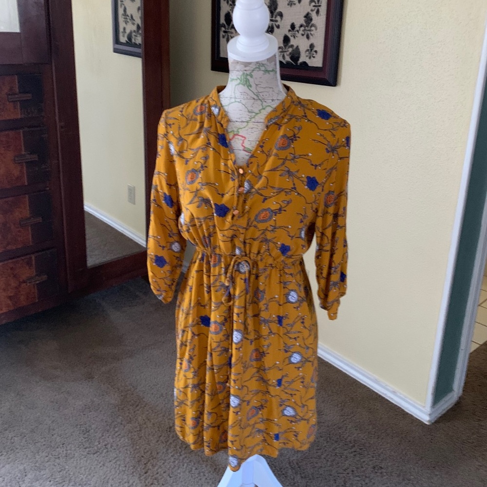Mustard yellow dress with blue floral pattern